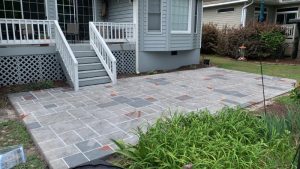 wood grain stamped concrete patio installed by Superb Concepts